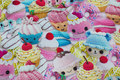 Fun cotton-jersey with knitted cupcakes in pastel-colors Fun cotton-jersey with knitted cupcakes in pastel-colors