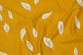 Soft yellow interlock-jersey with white leaves Soft yellow interlock-jersey with white leaves