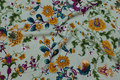 Delicate green viscose-mousselin with flowers Delicate green viscose-mousselin with flowers