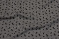 Grey-speckled, softened sweatshirt fabric with black ants Grey-speckled, softened sweatshirt fabric with black ants