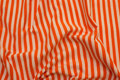 Across-striped, gennemfarvet cotton-jersey in orange and white Across-striped, gennemfarvet cotton-jersey in orange and white