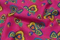Pink poplin with big and small hearts in yellow, blue etc. Pink poplin with big and small hearts in yellow, blue etc.