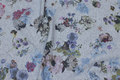 Grey-speckled, lightweight sweatshirt fabric with flowers Grey-speckled, lightweight sweatshirt fabric with flowers