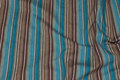 Across-striped brown and turqoise, stretch along fabric Across-striped brown and turqoise, stretch along fabric