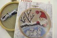 Embroidery snowy landscape and rabbits