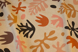 Linen-look with ca. 10 cm big motifs in rust and black