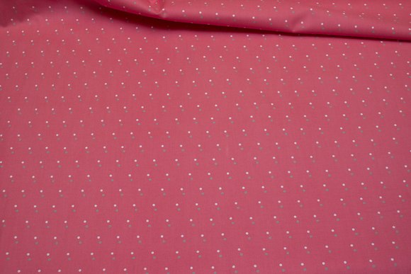 Coral-color cotton with small white and sand-colored dots