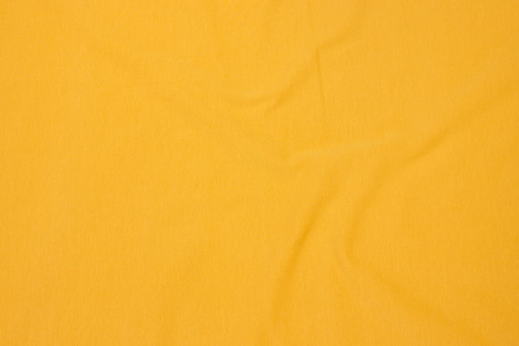 Cotton-jersey in brass-yellow