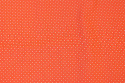 Firm, coral-color cotton with white mini-dots