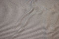 Light grey heavyjersey with white stripes along fabric length