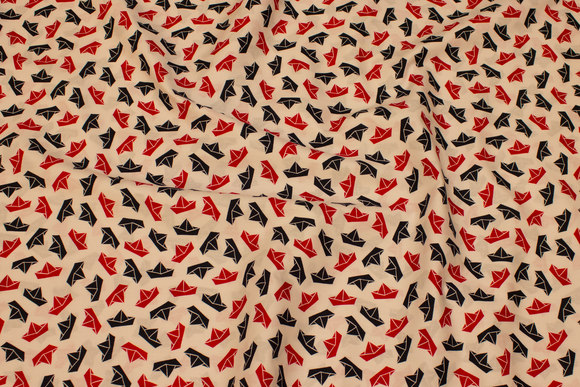 White, firm cotton with navy and red paper ships