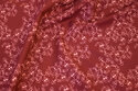 Wine-red, firm cotton with coral flowers