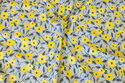 Light cotton in light grey with ca. 2-3 cm yellow flowers