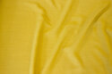 Light, soft viscose and linen-crepe in brass-yellow