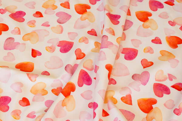 Off white cotton-jersey with 2-4 cm hearts