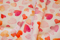 Off white cotton-jersey with 2-4 cm hearts