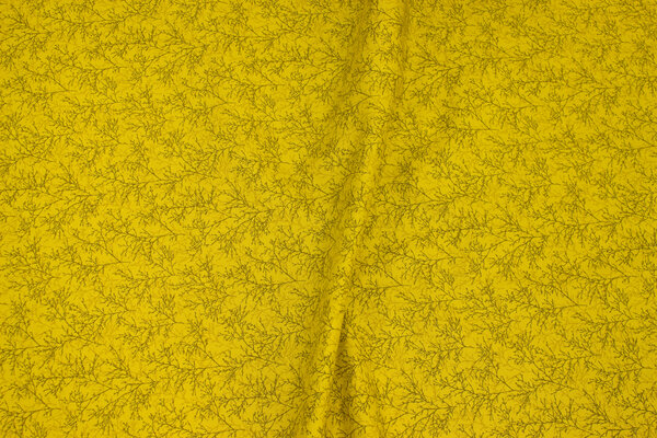 Brass-yellow patchwork-cotton with small branch-pattern