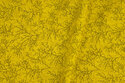 Brass-yellow patchwork-cotton with small branch-pattern