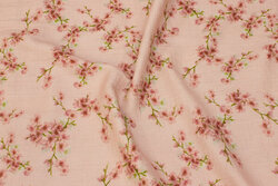 Double-woven cotton gauze in melon with soft red flowers