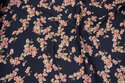 Double-woven cotton gauze in navy with soft red flowers