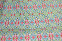 Light green cotton with soft red pattern