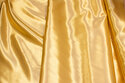 Polyester-satin in gold-color
