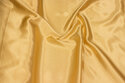 Polyester-satin in light golden