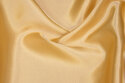 Polyester-satin in light golden