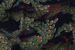 Soft, viscose mousselin in dark navy with large peacock-pattern