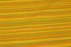 Dark yellow cotton with narrow, colorful across-stripes