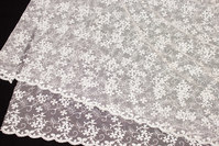 Beautiful, off white soft tulle-lace with small flowers in shiny embroidery
