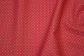 Firm coral-color cotton with white mini-dots