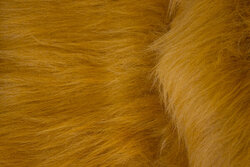Long-haired, faux fur in lion-colored golden-brown