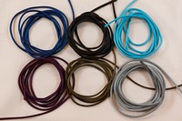 Sateen string in blue, black, turqoise, purple, grey