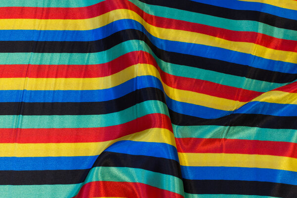Carneval satin with ca. 15 mm wide stripes along length