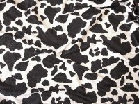 Crushed velvet in shiny quality with cow print