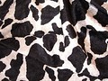 Crushed velvet in shiny quality with cow print