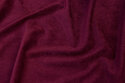 Narrow-corded red-purple baby corduroy in polyester with light stretch