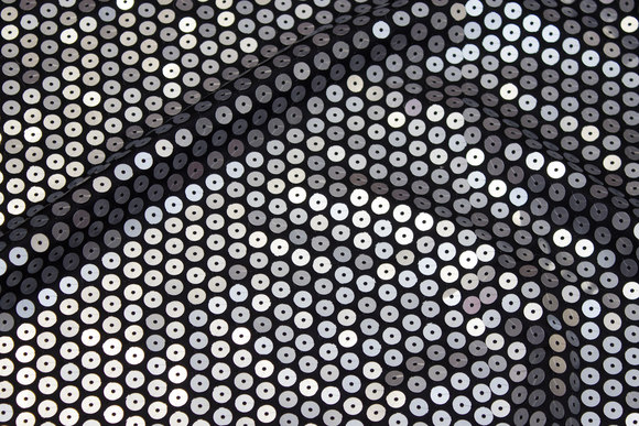 Stretch-sequins-fabric in black with big sewn-on aluminiumsfarvede sequins