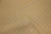 Light sand-colored textile-table-cloth with 8 mm white dot