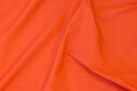 Thin, light coated crinkle pilotnylon in orange