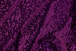Silky stretch-velvet in red-purple with surface-textured pattern