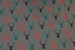 Dark grey cotton-jersey with ca. 4 cm dear-heads in navy and green and red