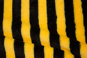 Supersoft micro-teddy, across-striped in black and yellow