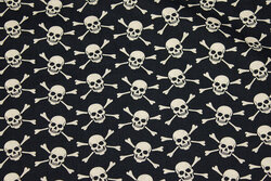 Black cotton with 2 cm sand-colored skulls and bones