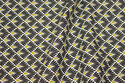 Firm cotton with small retro-pattern in black and olive-colored