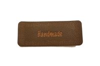 Handmade brown leather-look iron on patch 6 x 2 cm.