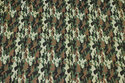 Light cotton with camouflage-pattern in green and brown nuances