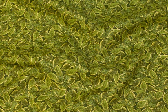 Patchwork-cotton in green and gold with leaf-pattern