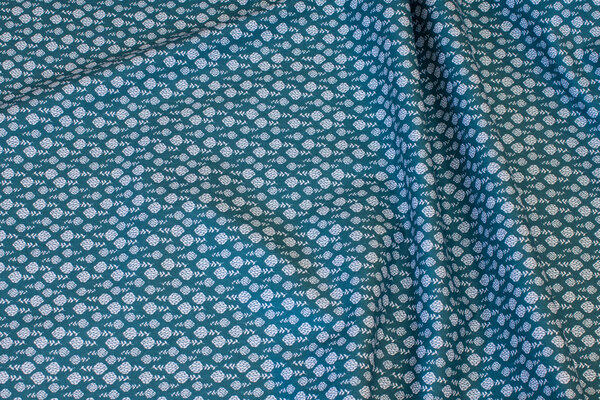 Dark green cotton with small white pattern